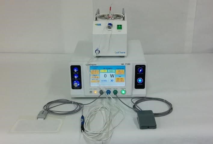 A CoATherm radiofrequency ablation generator console with touchscreen, cooled-tip pump, RF probe, grounding pad, and foot pedal