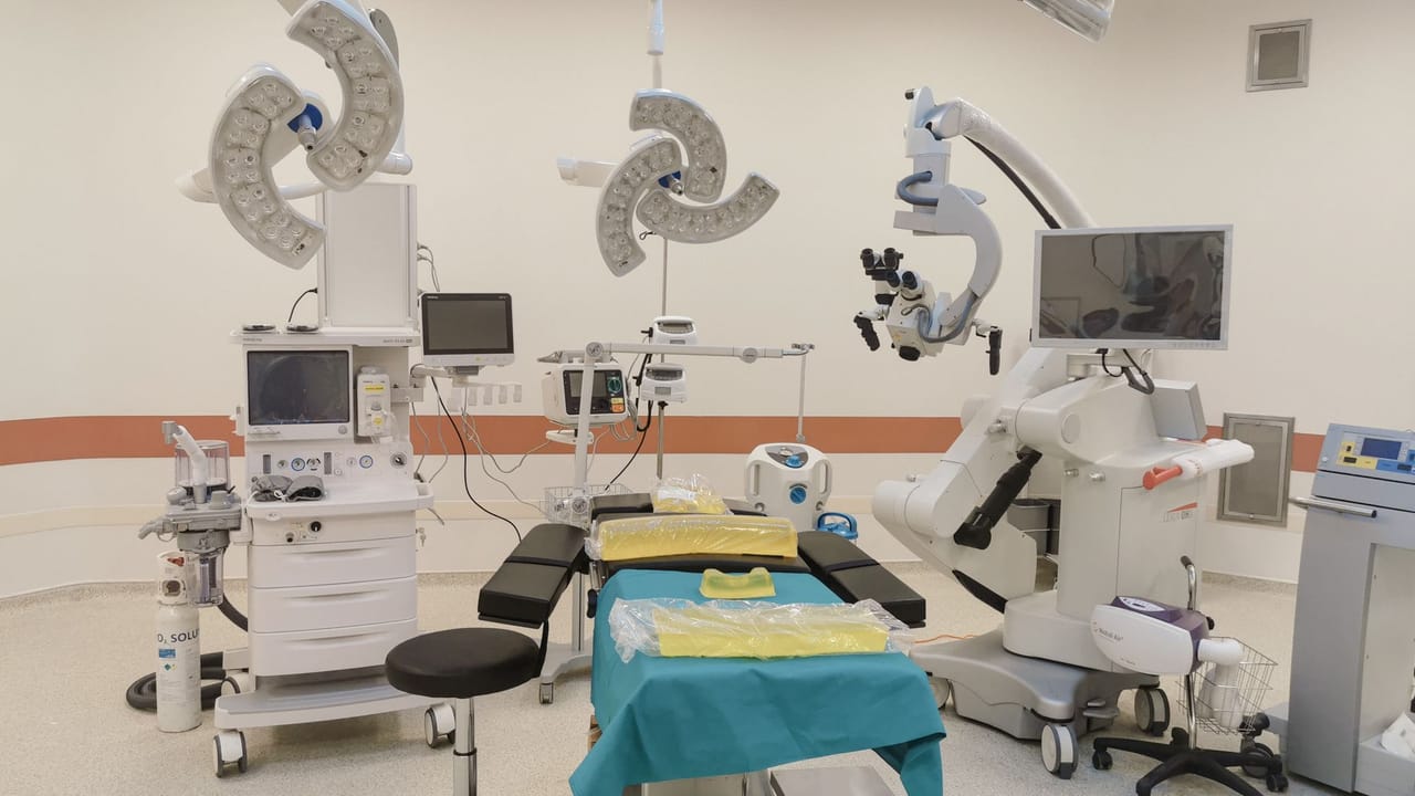 Technicians inspecting a ventilator to assess its condition and service history.