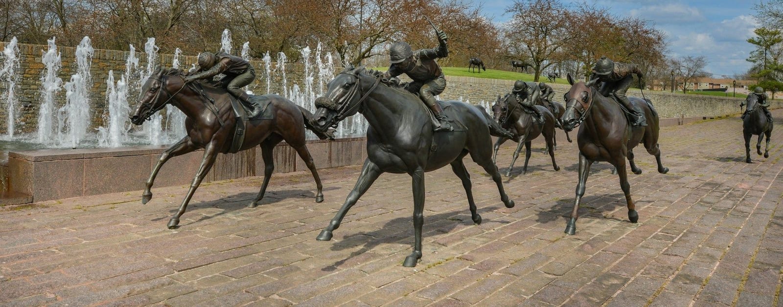 Bronze racehorse and jockey statues at Thoroughbred Park in downtown Lexington