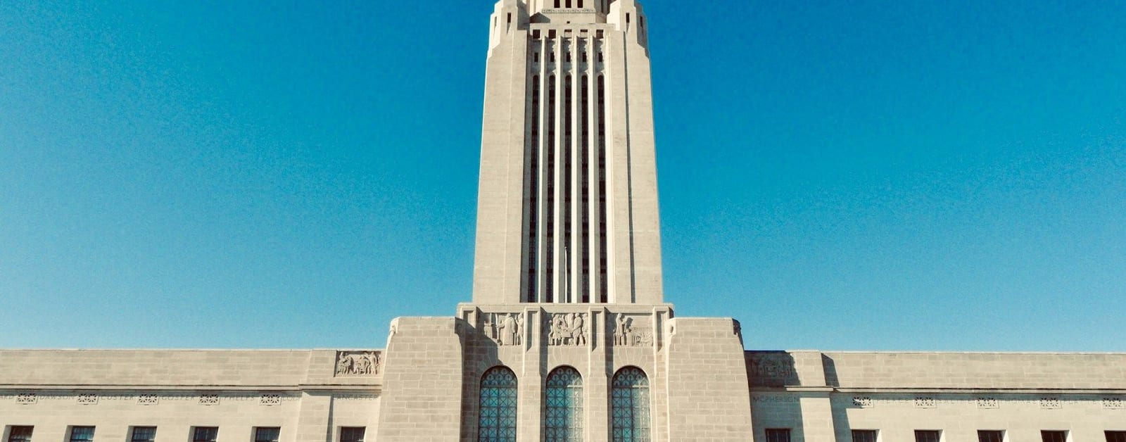 The Nebraska State Capitol tower in Lincoln, topped by the Sower statue