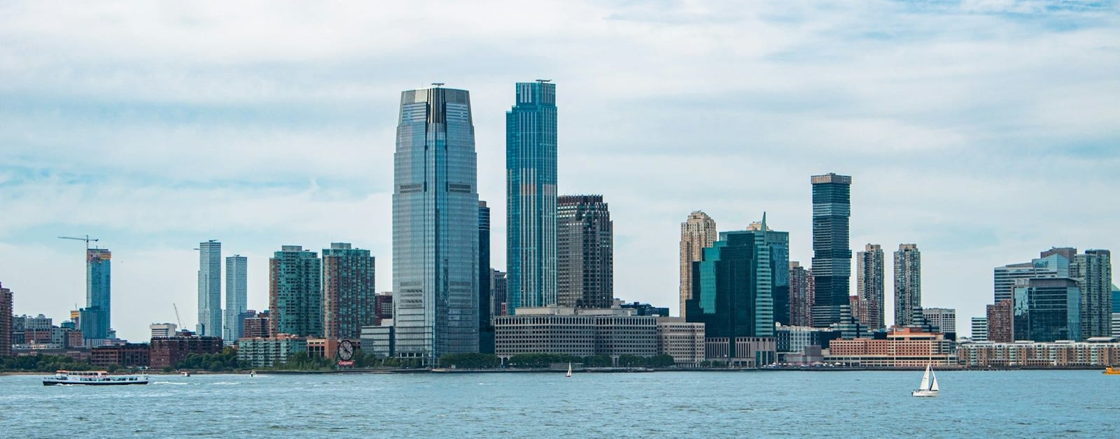 Jersey City waterfront skyline with the Goldman Sachs Tower and 99 Hudson across the Hudson River