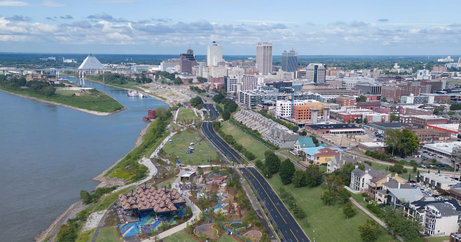 Aerial view up the Mississippi riverfront to downtown Memphis and the Pyramid, Tennessee
