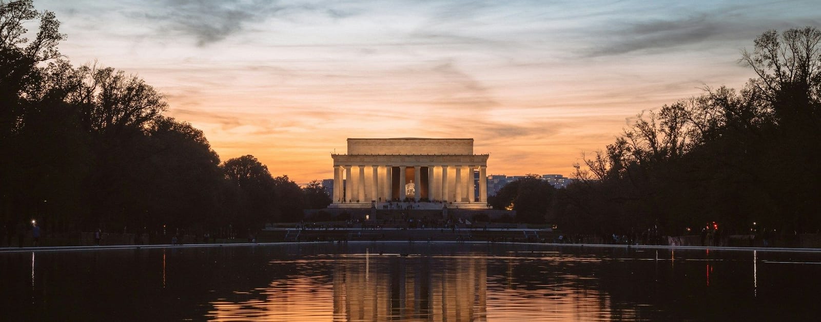 The Lincoln Memorial at sunset across the Reflecting Pool on the National Mall, Washington, D.C.